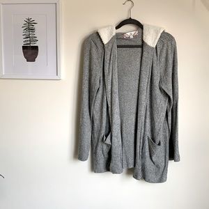 Cozy cardigan, has a hood with fleece lining. Very soft. Lightly used.